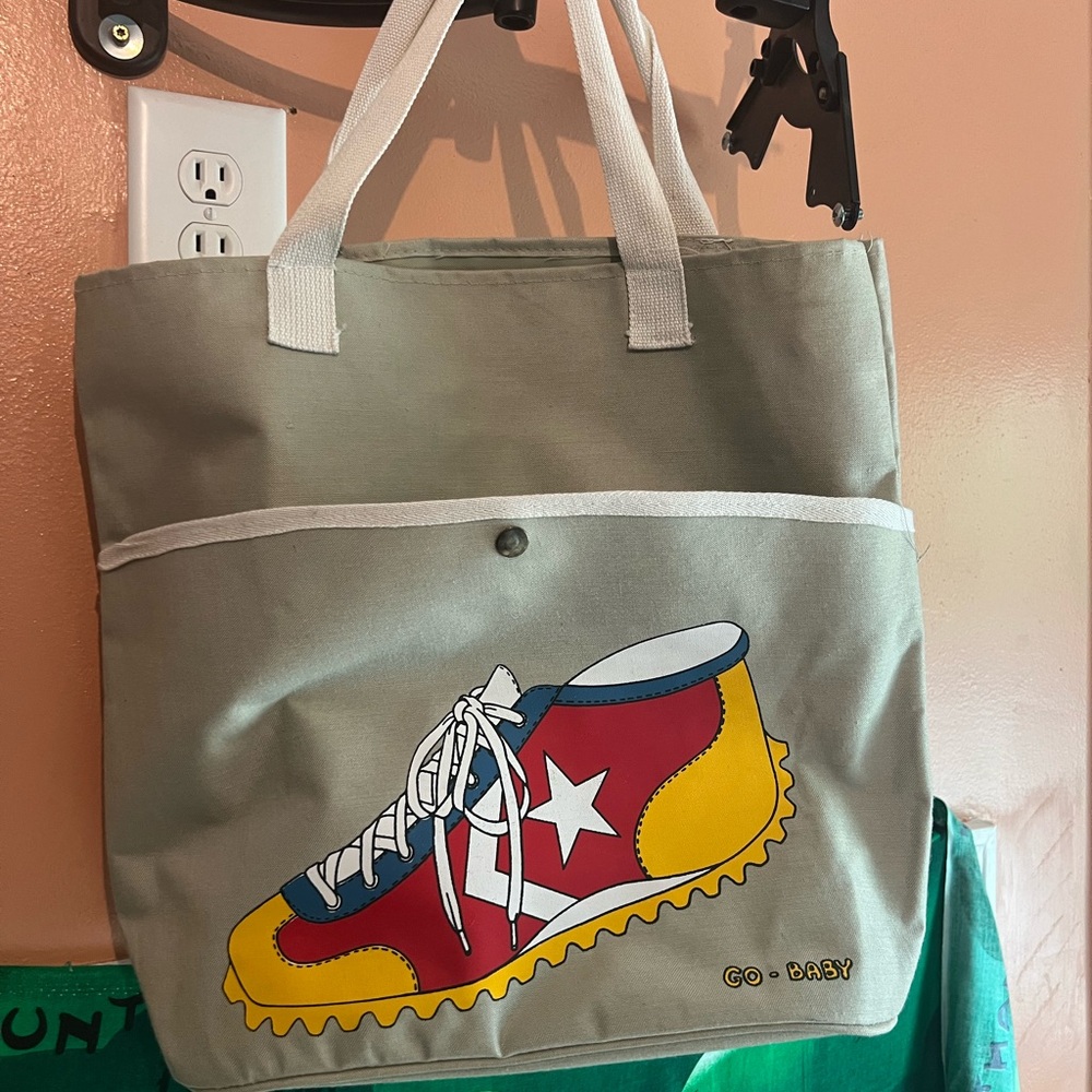 vintage 1980s canvas bag with track on it says go baby